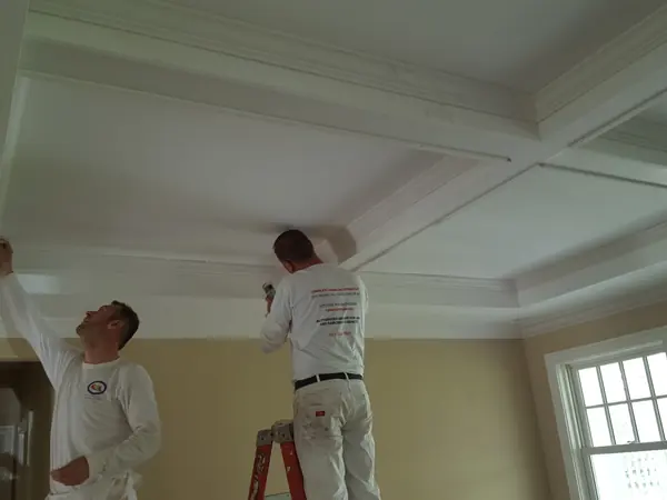 Crew painting a coffered ceiling