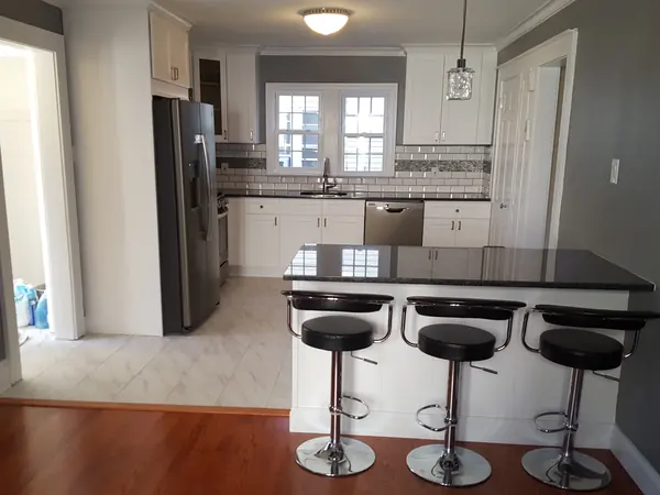 Kitchen with breakfast bar and stools
