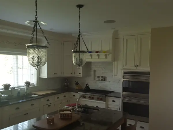 Remodeled kitchen with pendant lights